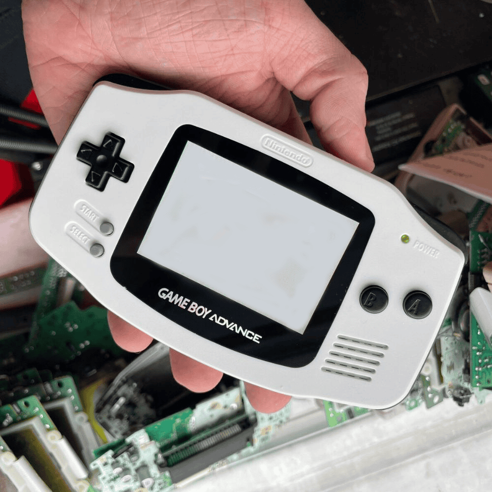 White Game Boy Advance console with IPS backlit screen mod for enhanced gaming experience.
