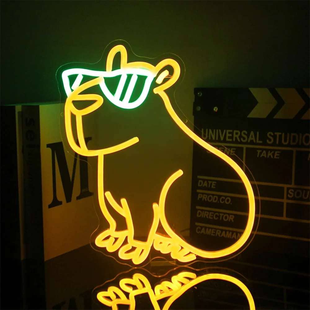 Neon sign featuring a playful mouse wearing sunglasses, ideal for modern decor and entertainment ven.