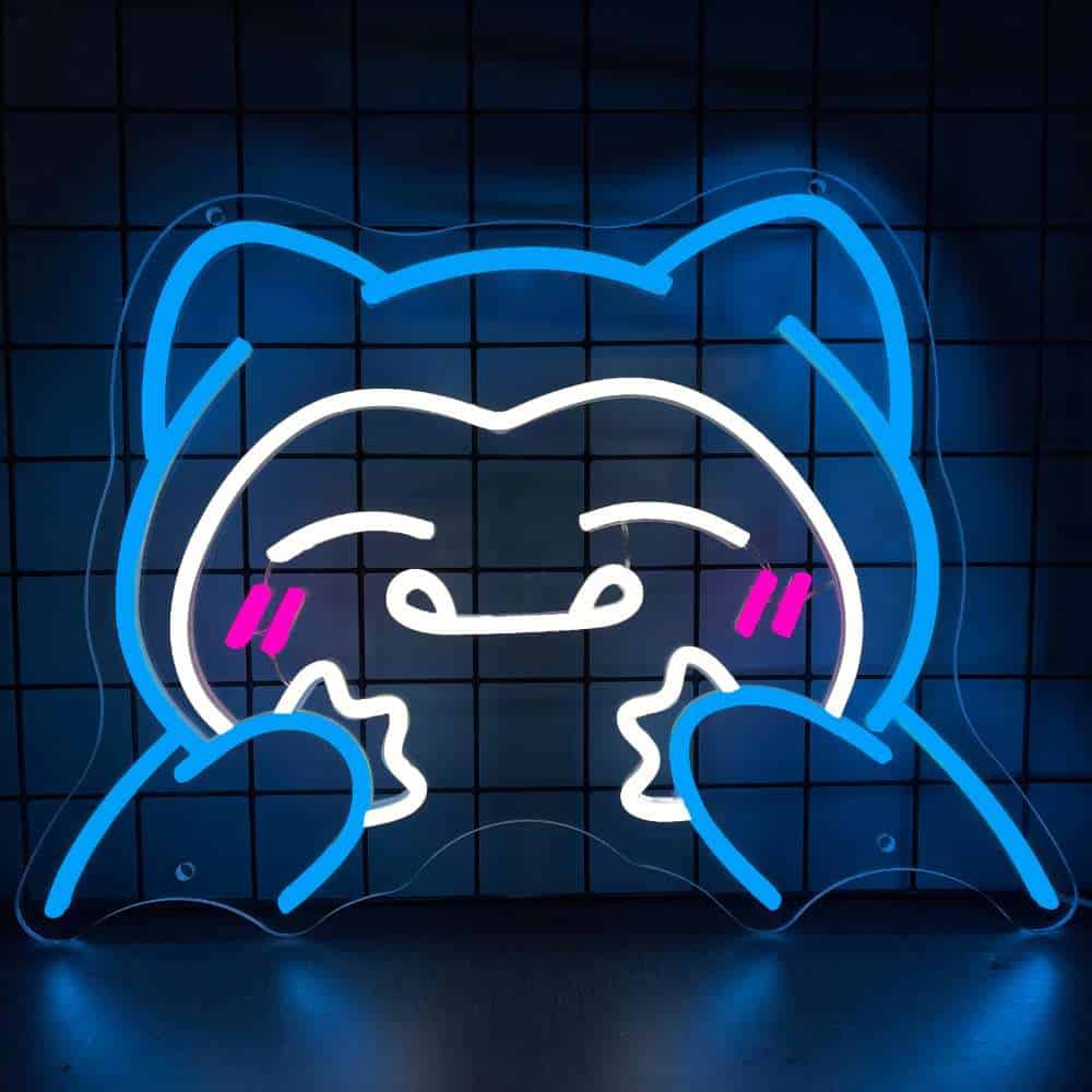Neon cat face sign with pink cheeks, blue outline, and playful expression for modern decor.