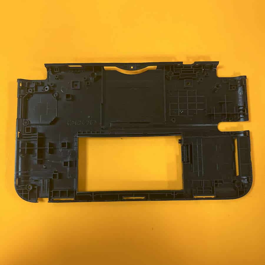 Back frame for Nintendo 3DS XL in white color, brand new, on yellow background.