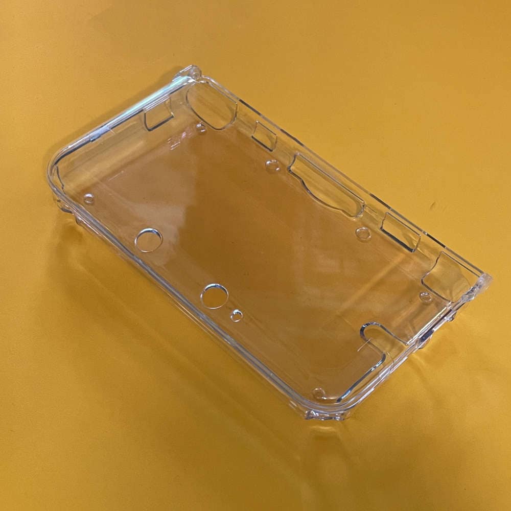 Protective case for 3DS XL gaming console, transparent and durable.