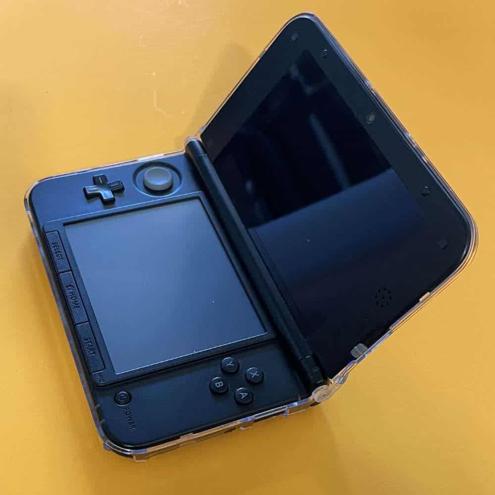 Protective case for Nintendo 3DS XL with screen cover and accessories.