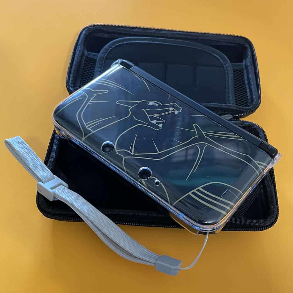 Protective case for Nintendo 3DS XL with a clear design featuring a dragon illustration.