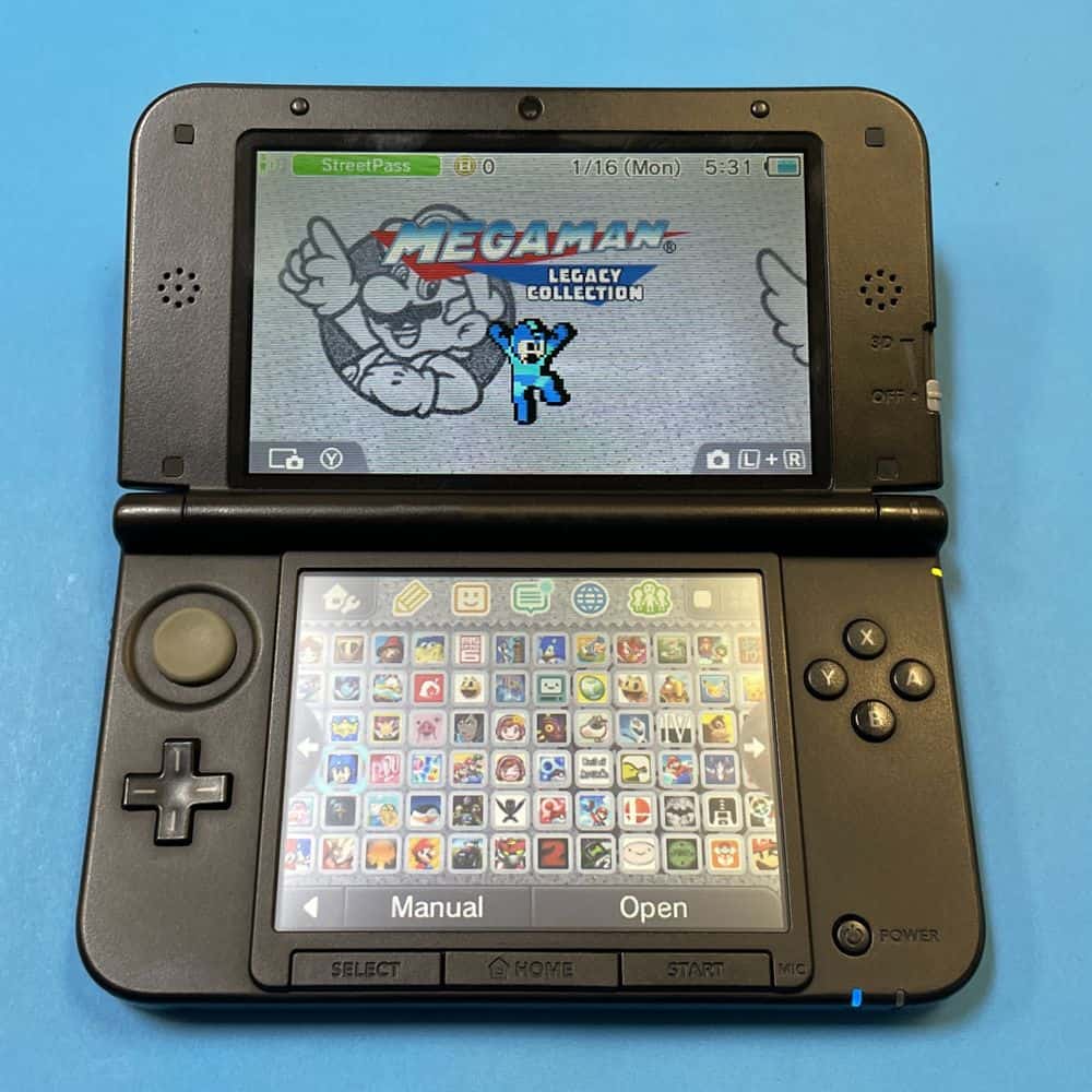High-quality image of a Nintendo 3DS XL / LL gaming console with Mega Man game on screen.