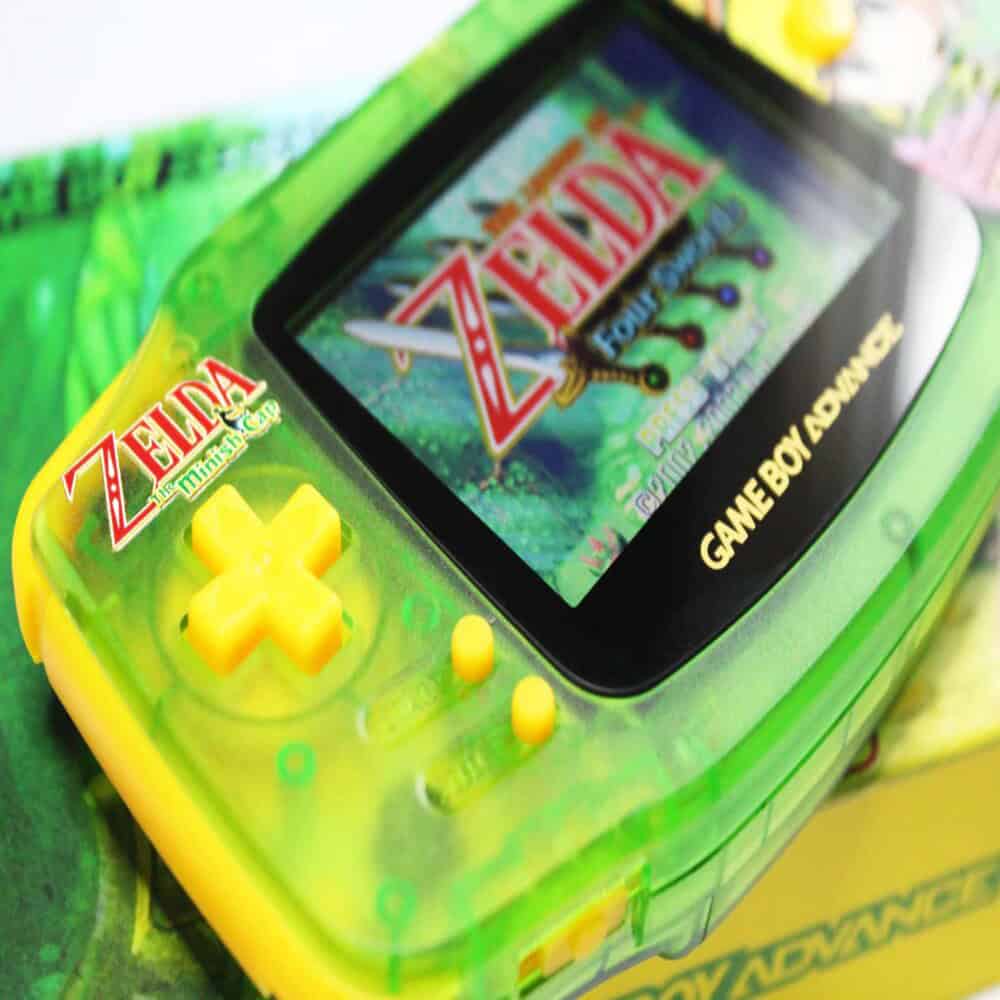 Custom backlit modded Nintendo Game Boy Advance with Legend of Zelda game.