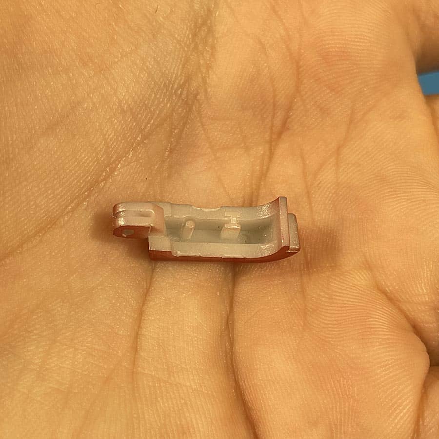 Alternative view of Left Shoulder Button for 3DS – Red Replacement Part