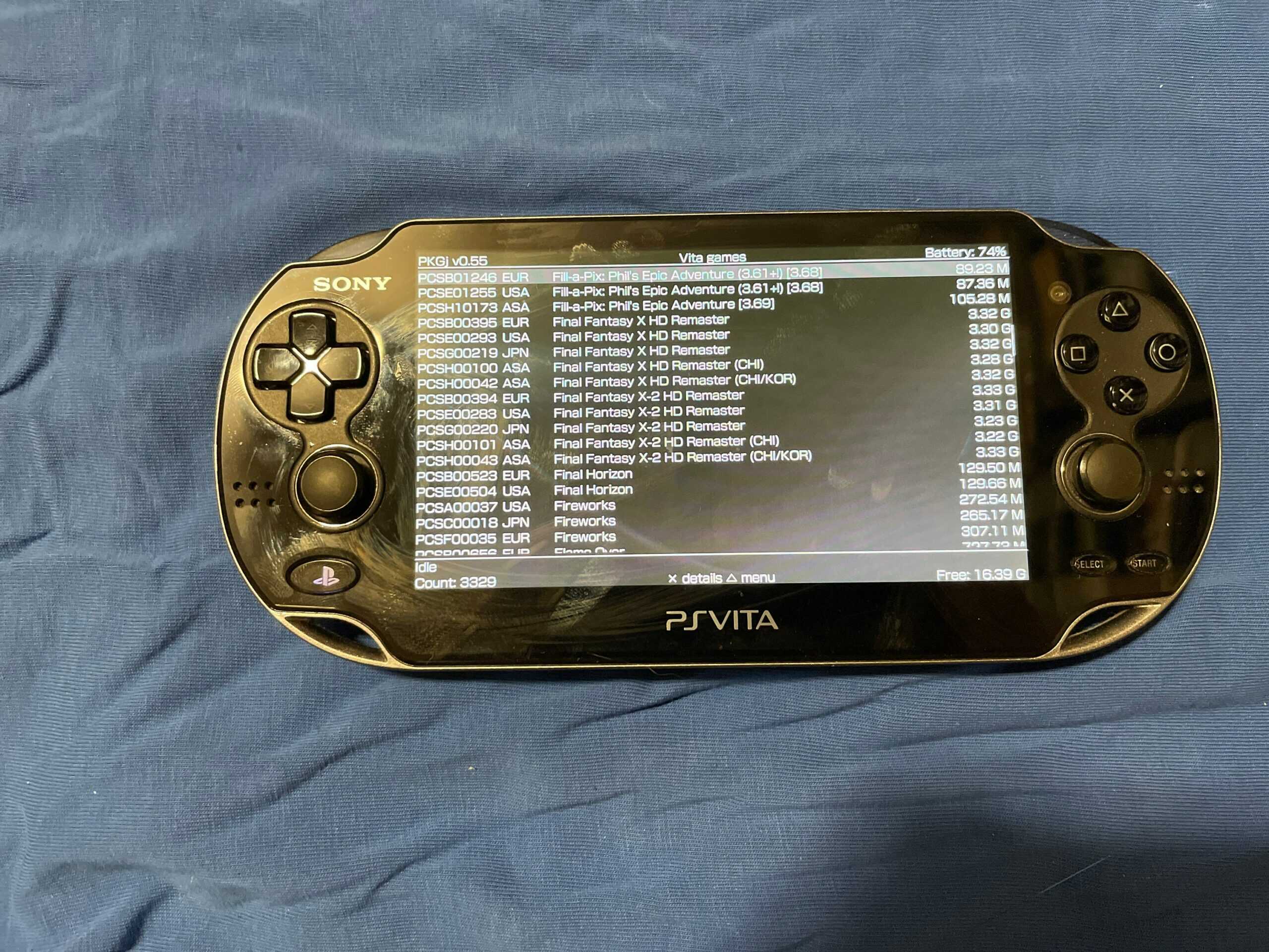 Sony PS Vita OLED handheld gaming console with custom firmware and 8000+ games.
