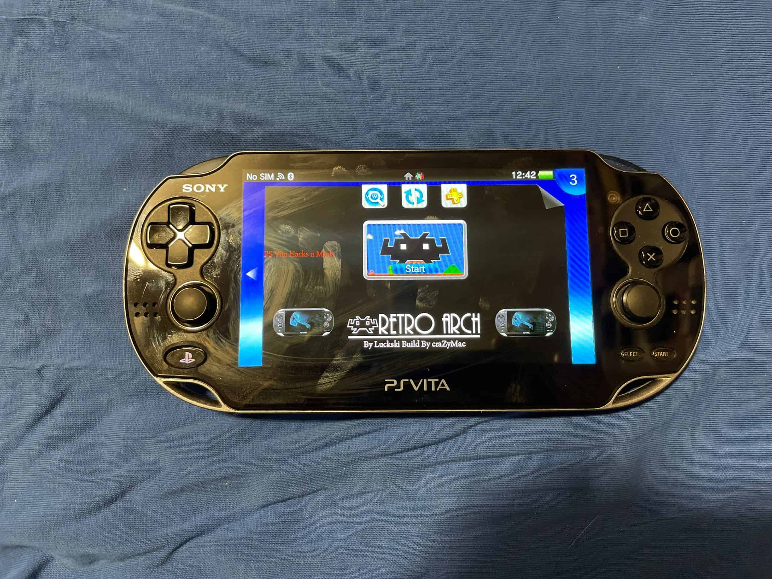 Sony PS Vita OLED Model 1000 handheld gaming console with custom firmware and extensive game library.