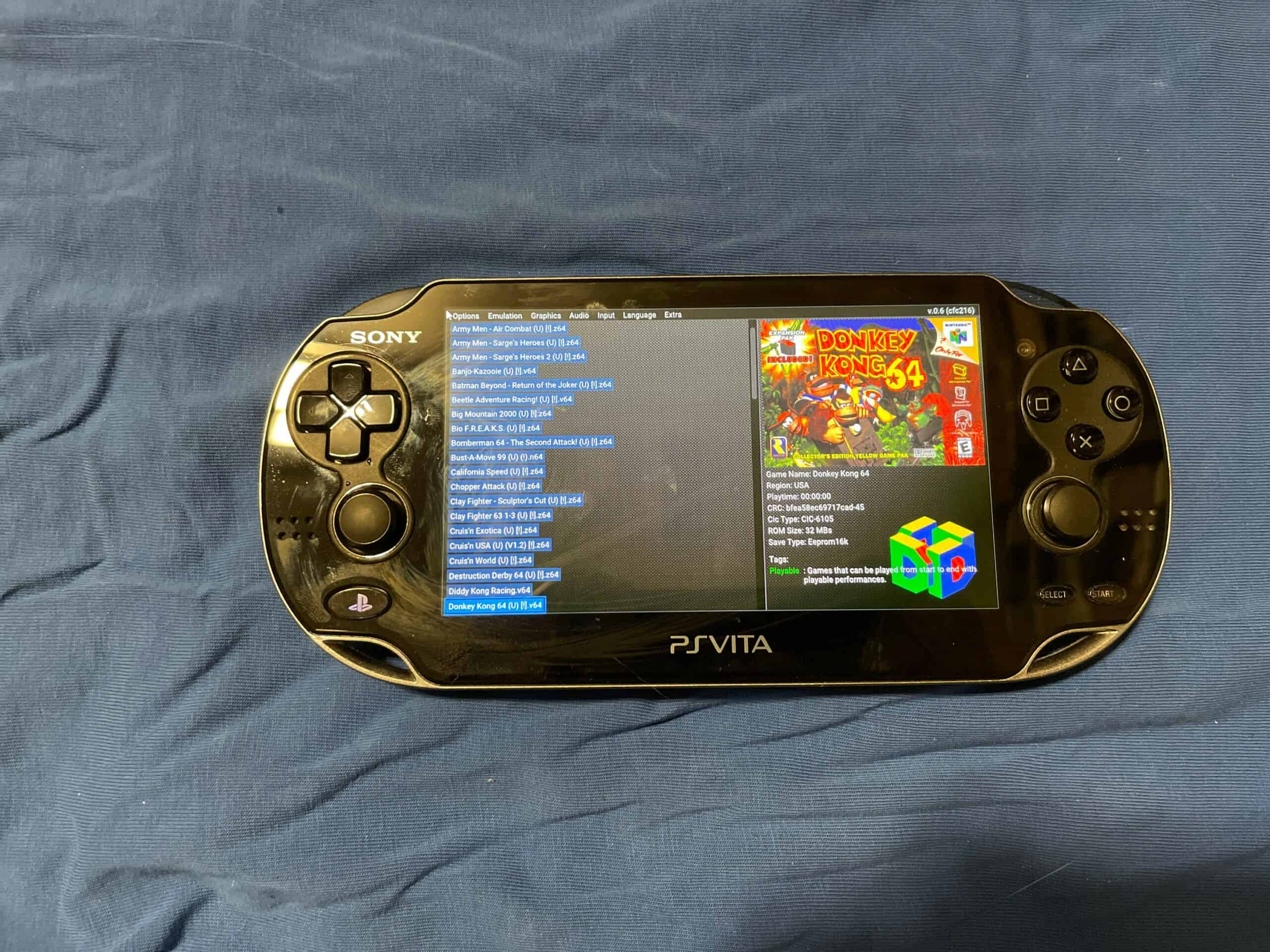 Sony PS Vita OLED handheld gaming console with custom firmware and 8000+ games.
