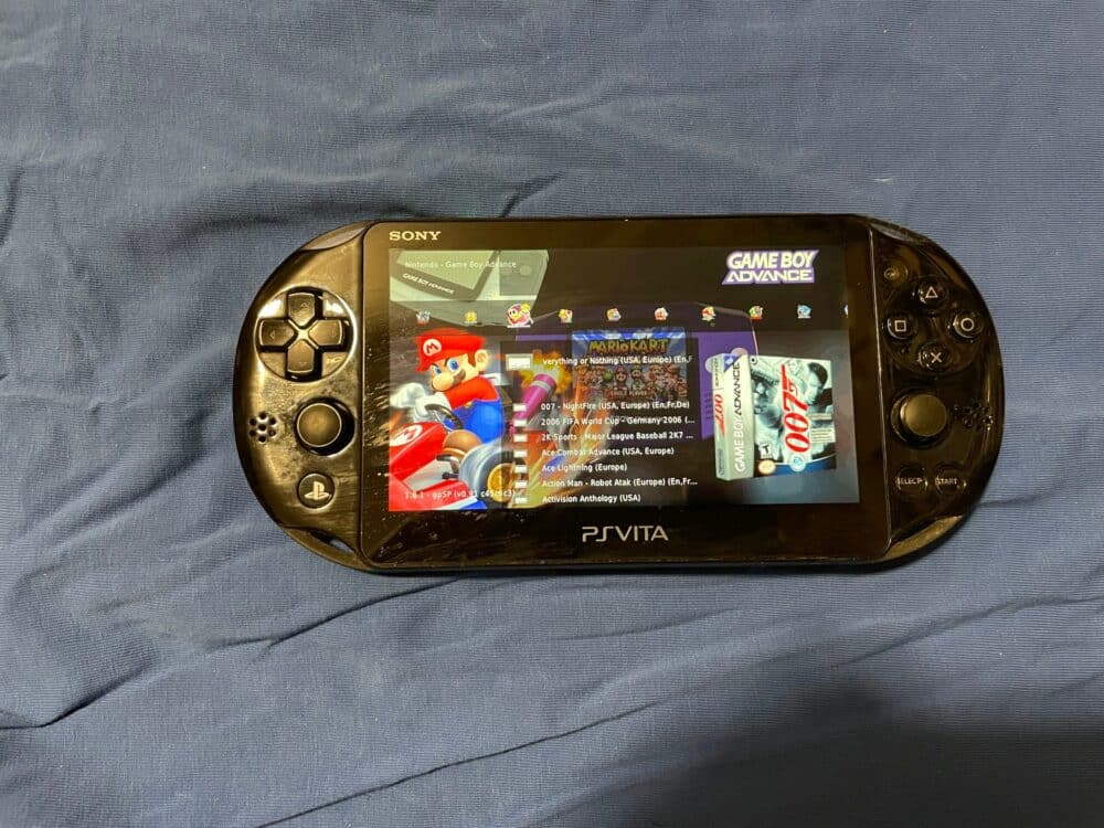 Sony PS Vita OLED model with 28GB, 256GB, 512GB, 1TB storage, homebrew, and 8000+ games.