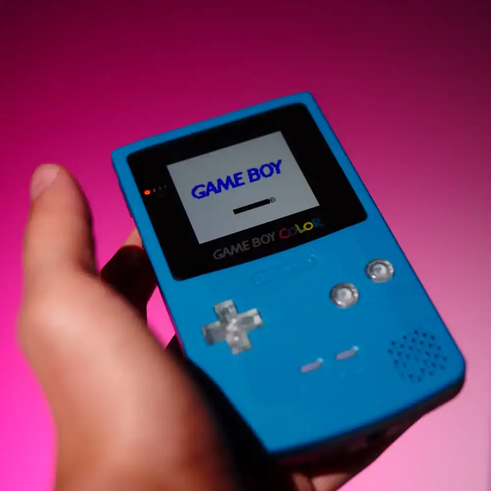 Game Boy Color handheld console with custom shell and mod options.