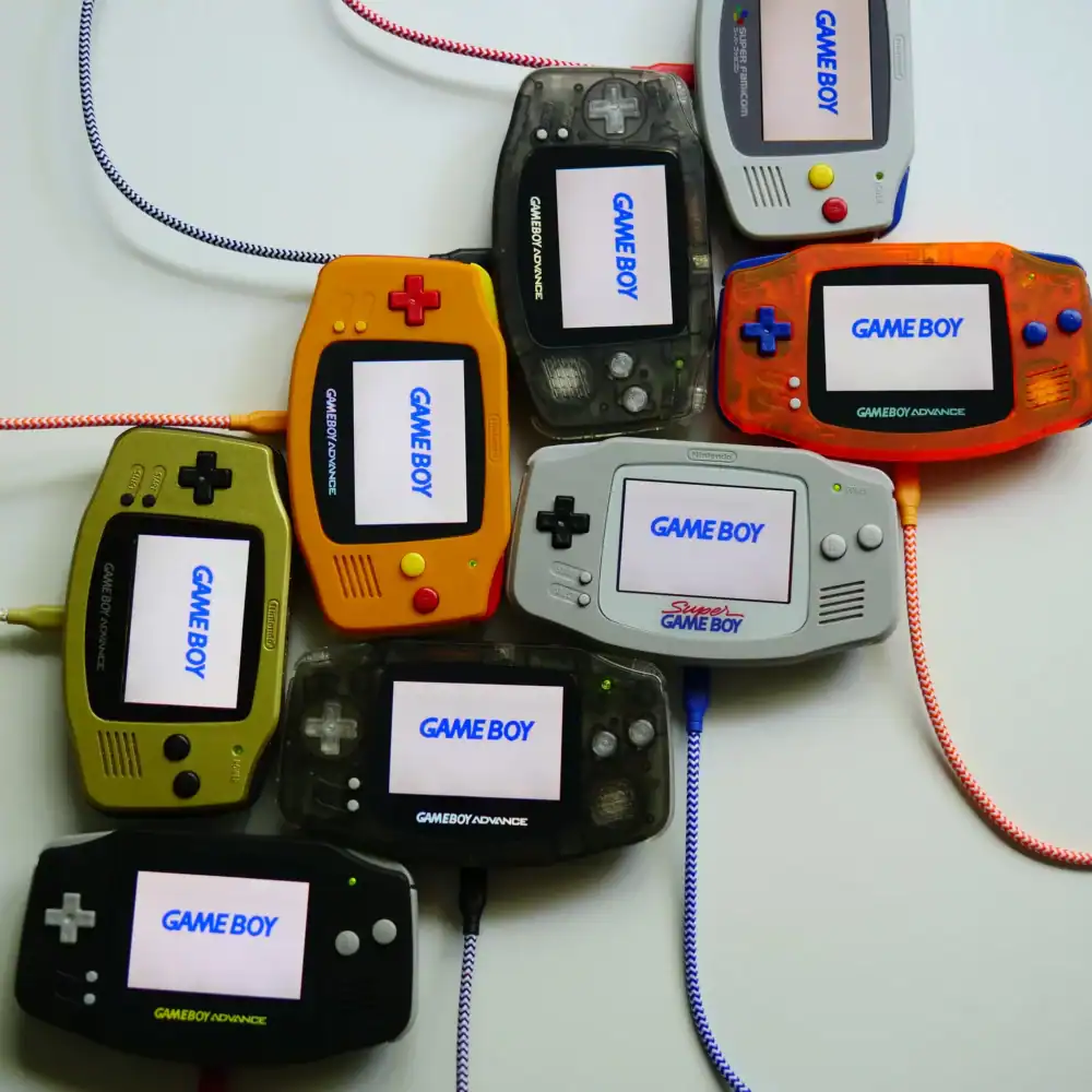 Custom Game Boy Advance handheld gaming console with vibrant shell options and mod features.