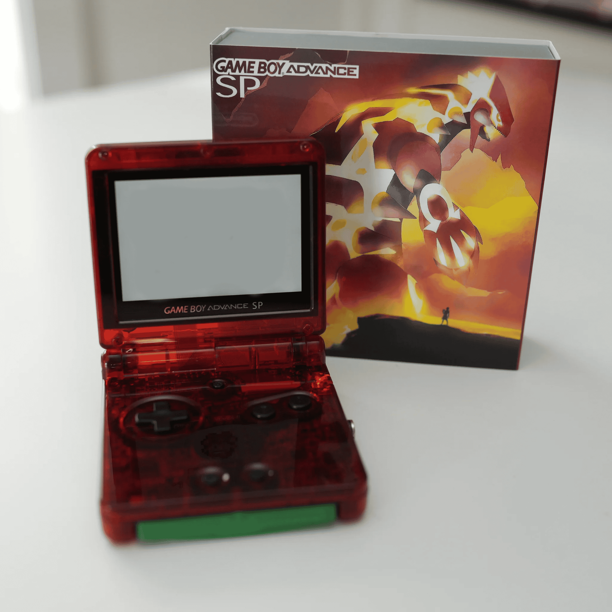 Groudon-themed Nintendo Game Boy Advance SP with IPS backlit mod and original box.