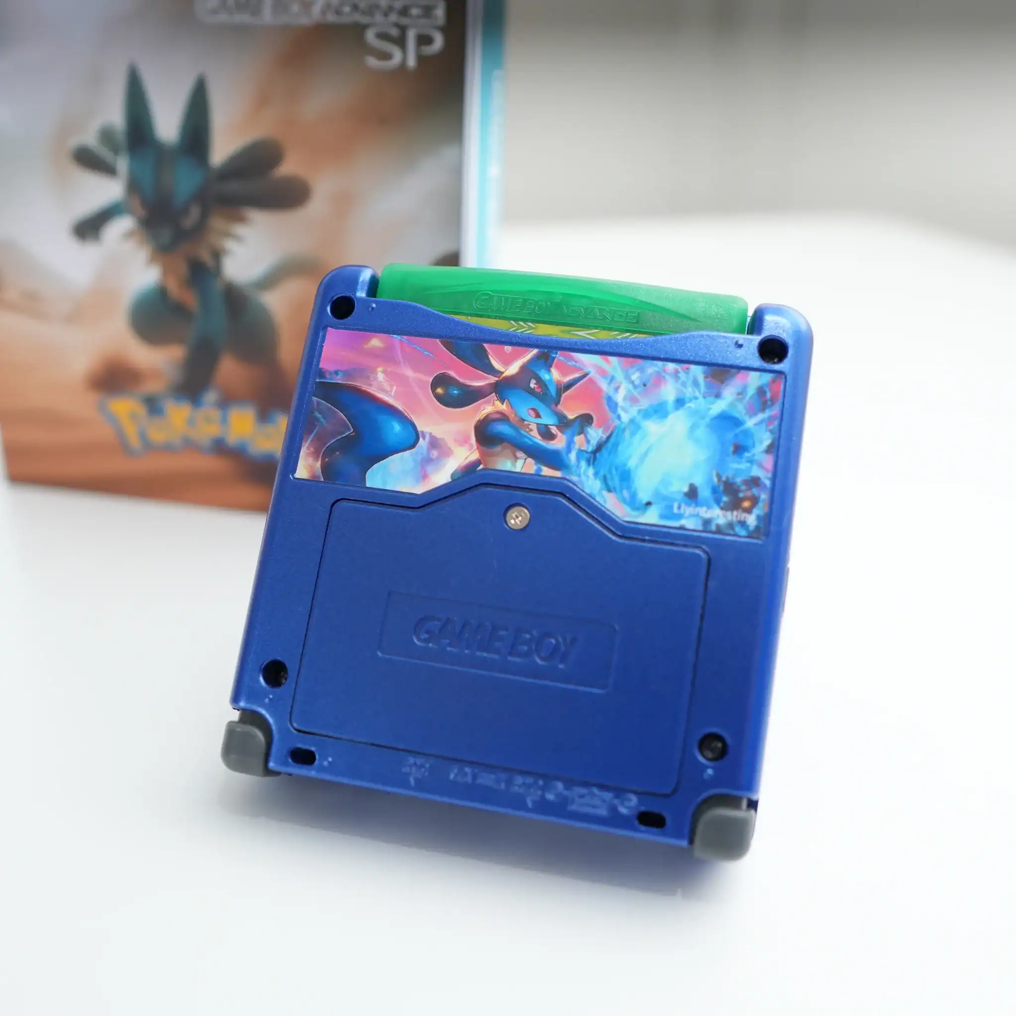 Lucario-themed Nintendo Game Boy Advance SP with backlit IPS screen and box.