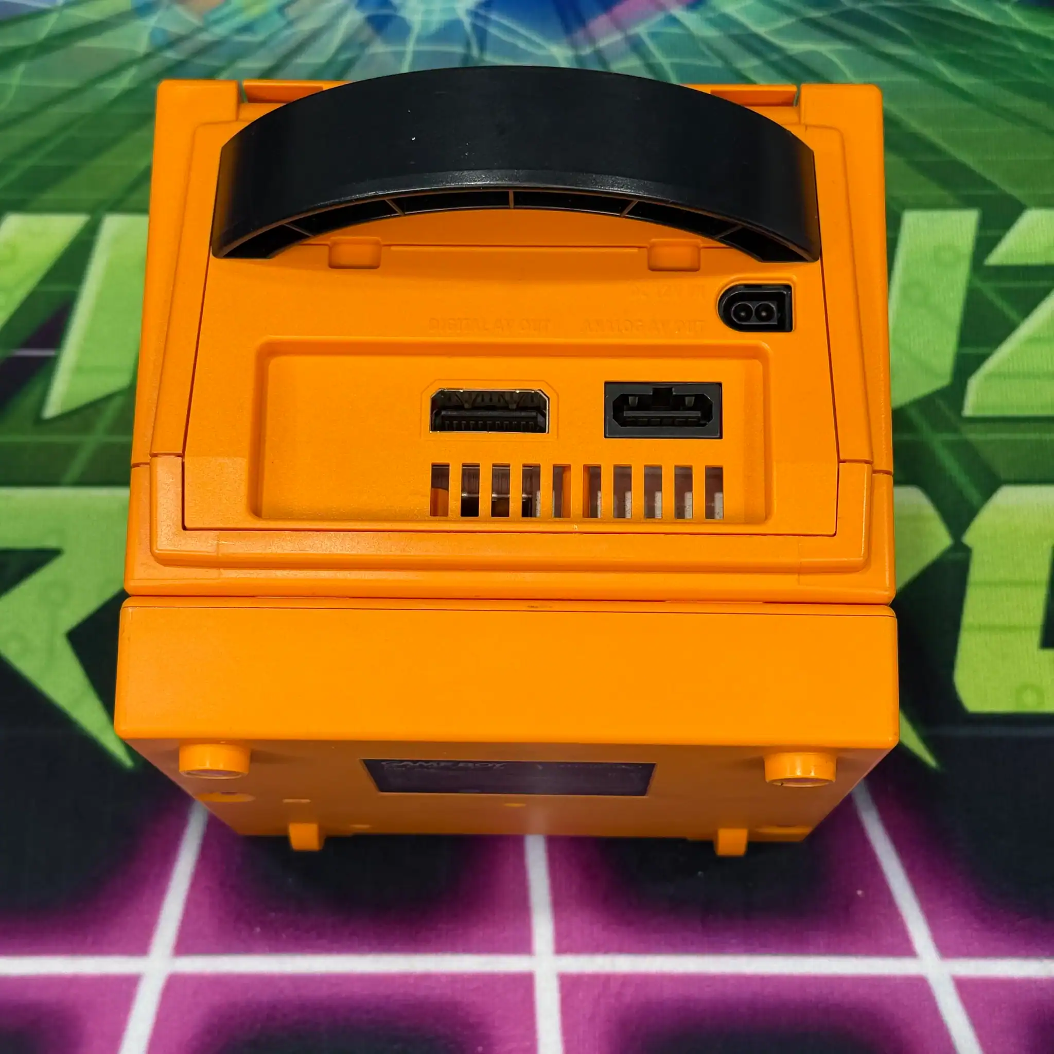 Spice Orange modded GameCube console with custom design.
