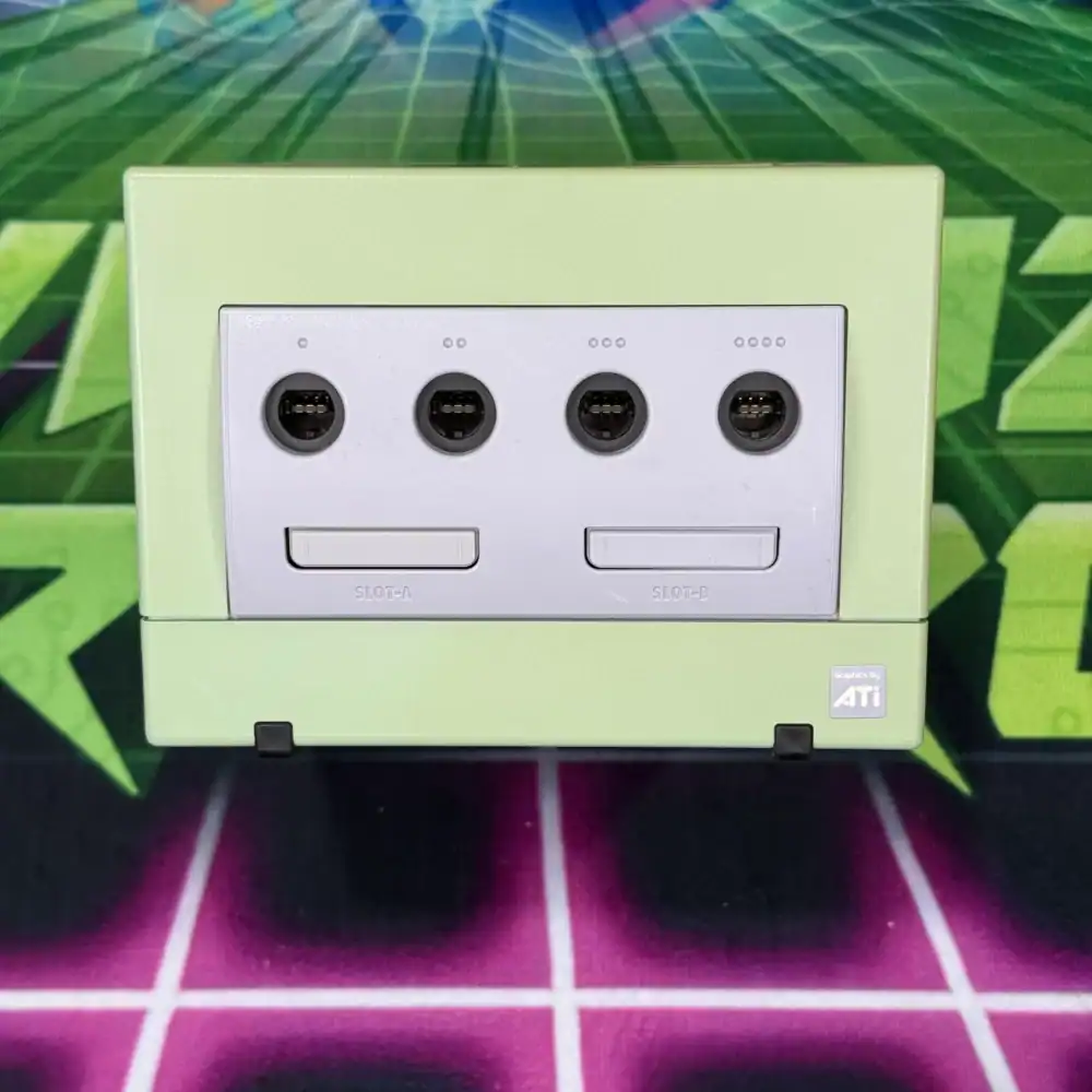 Custom green modded GameCube console with four controller ports and unique design.
