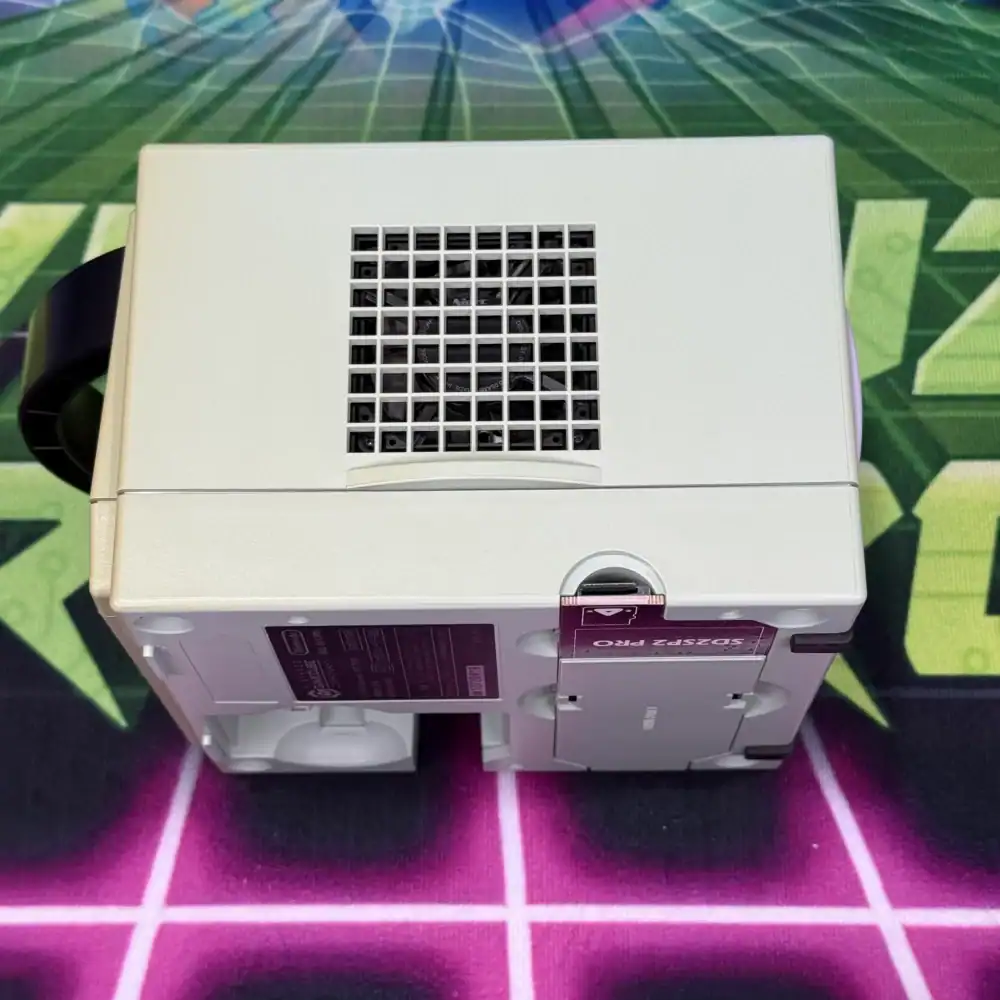Custom green GameCube with modded design and cooling vent.
