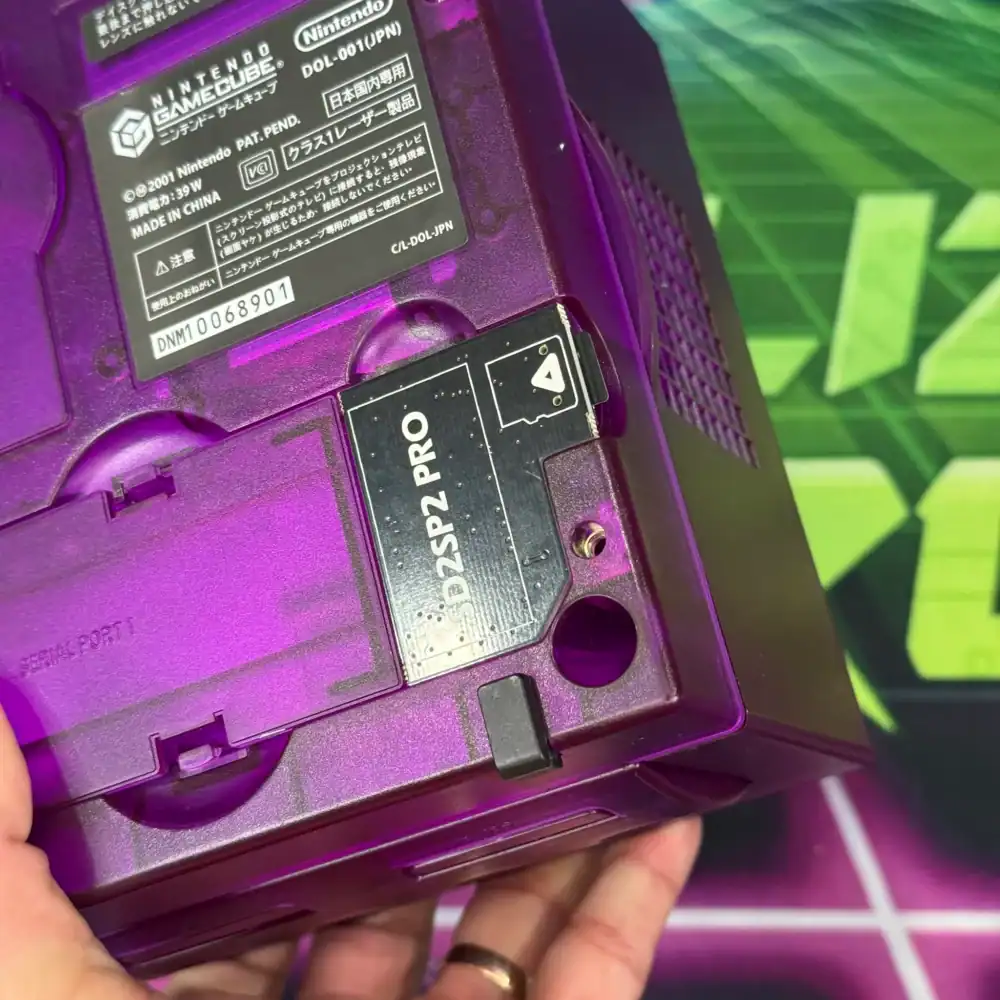 Custom purple transparent GameCube console with modded features.