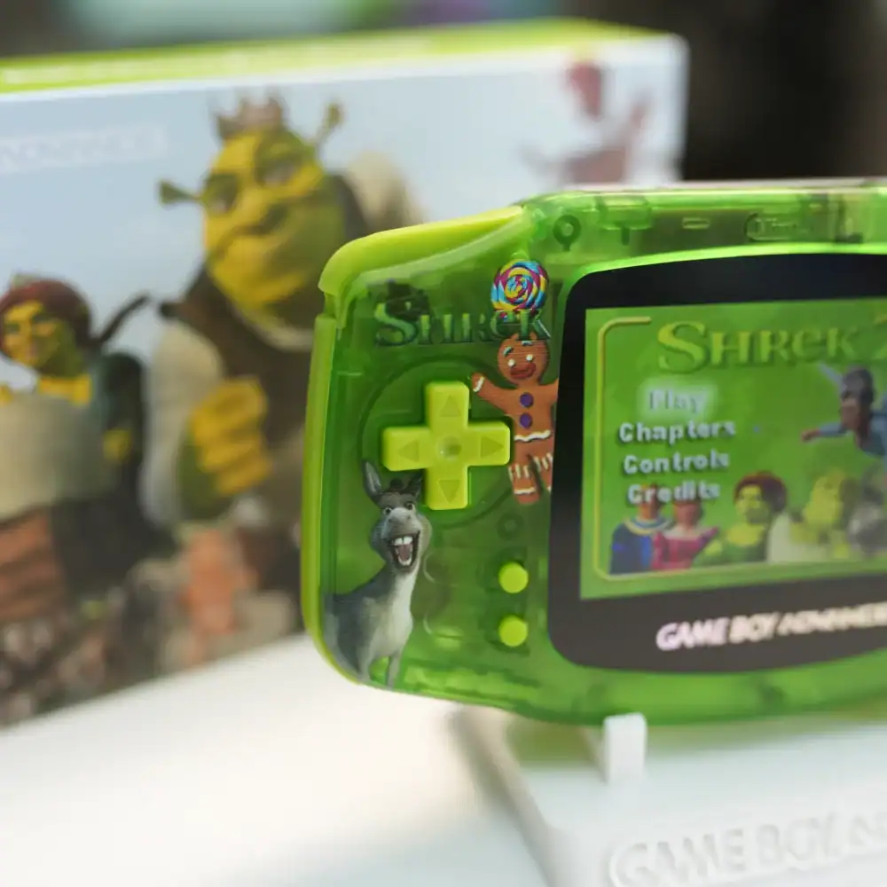 Portable Shrek-themed Game Boy Advance GBA console with IPS backlit screen and original box.