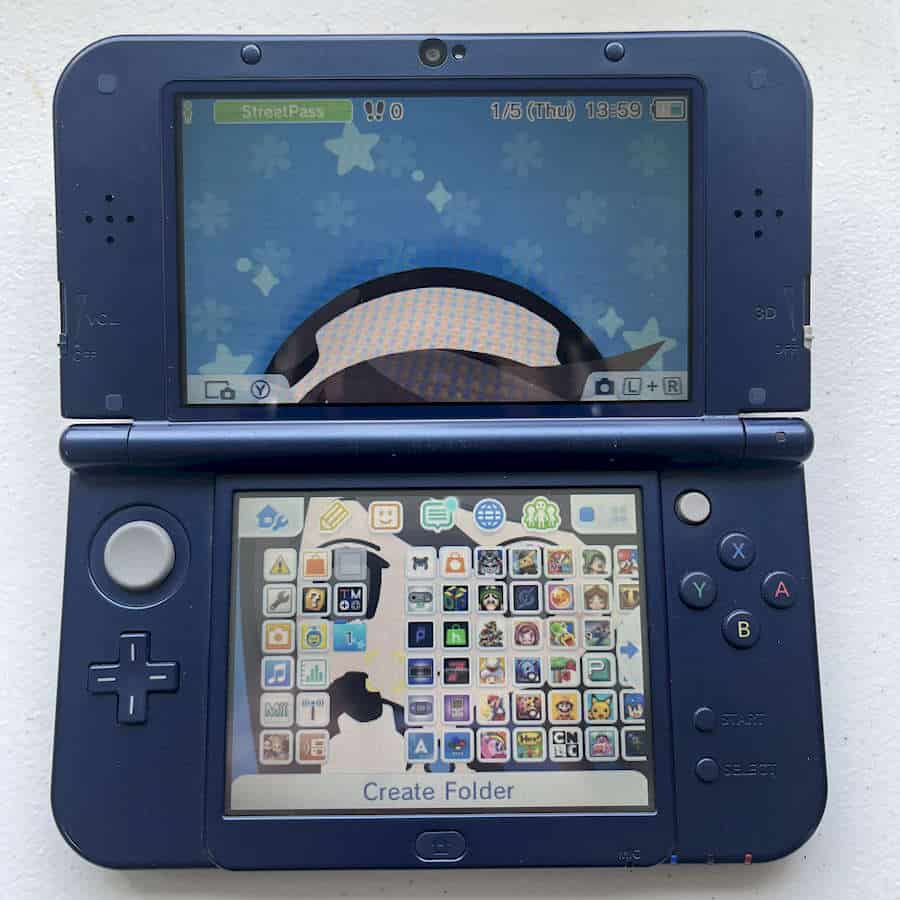 Refurbished blue Nintendo 3DS XL with 128GB storage and preloaded games.