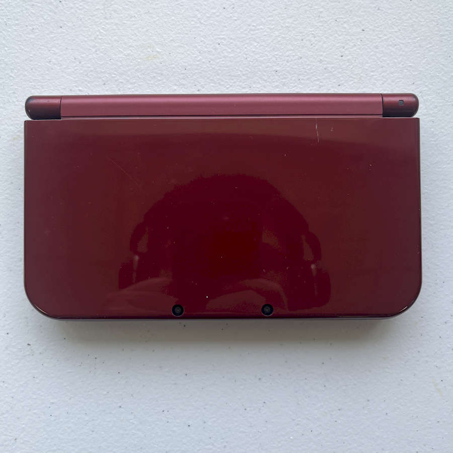 Refurbished red Nintendo 3DS XL with 128GB preloaded storage for gaming.