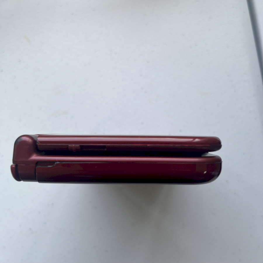 Refurbished red Nintendo 3DS XL with 128GB storage, ready to play.