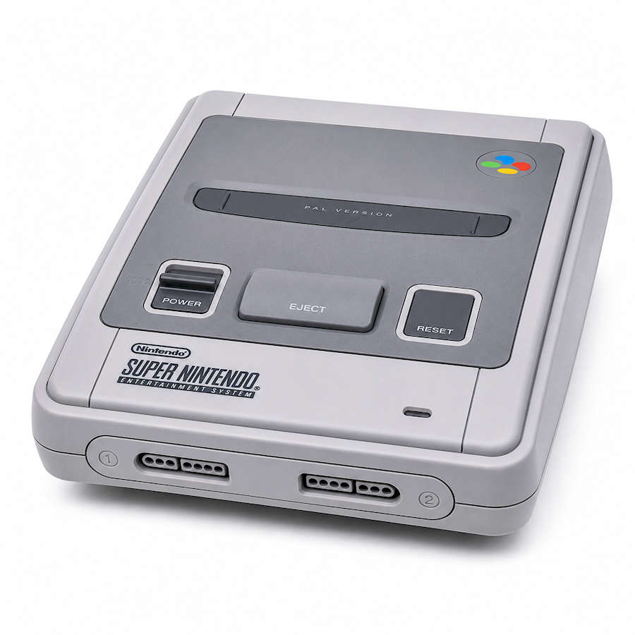 Super Nintendo console with controller ports and colorful logo on top.