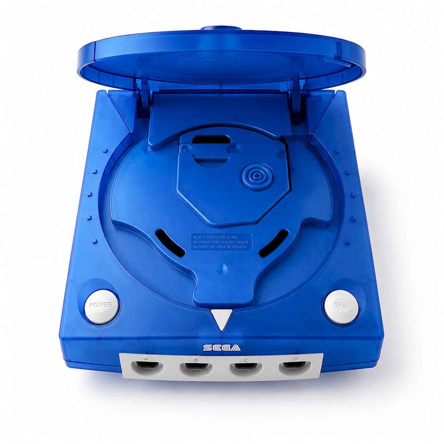 Blue modded Sega Dreamcast console with open lid and controller ports.