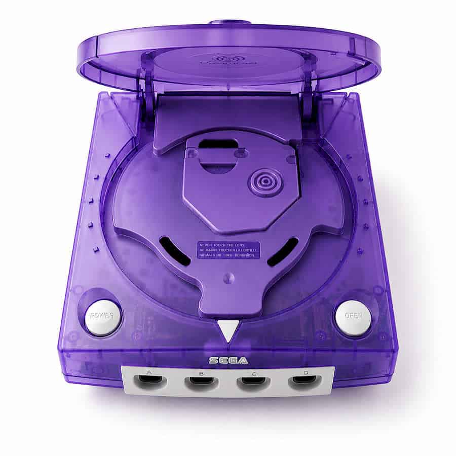 Modded purple SEGA Dreamcast console with transparent casing and open disc tray.