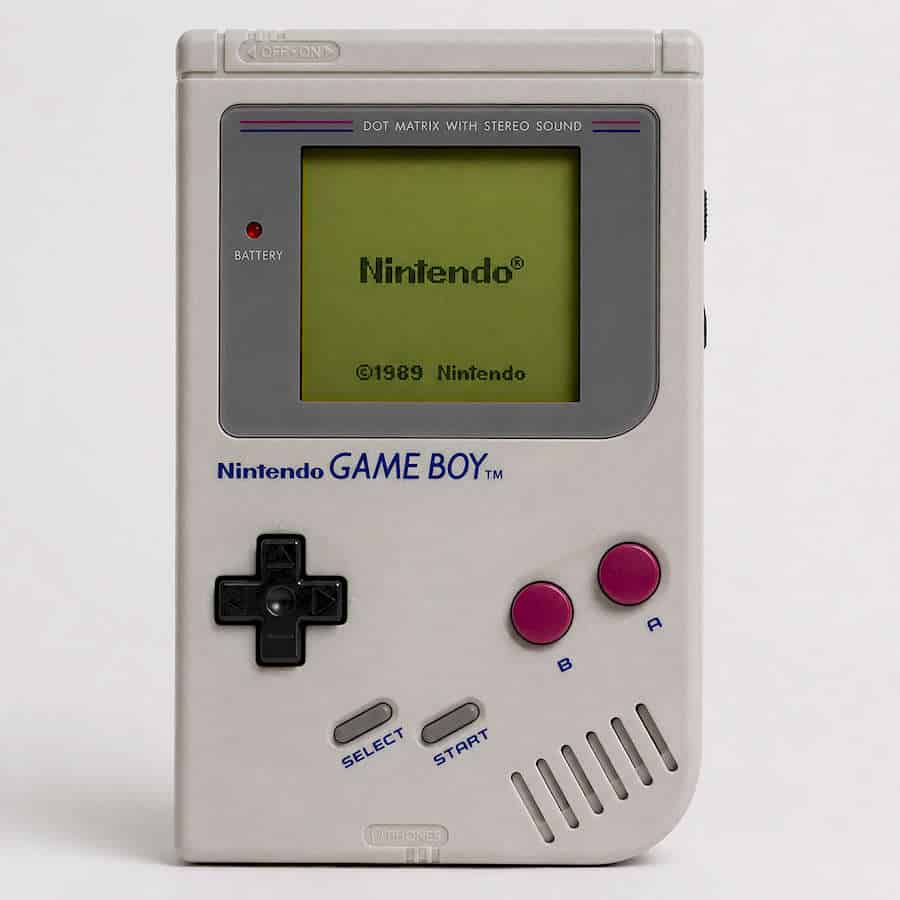 Vintage Nintendo Game Boy with gray body and pink buttons, 1989 model.