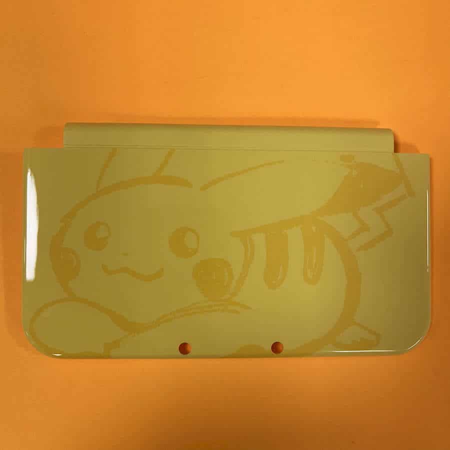 Yellow Pikachu themed shell cover for Nintendo 3DS XL.