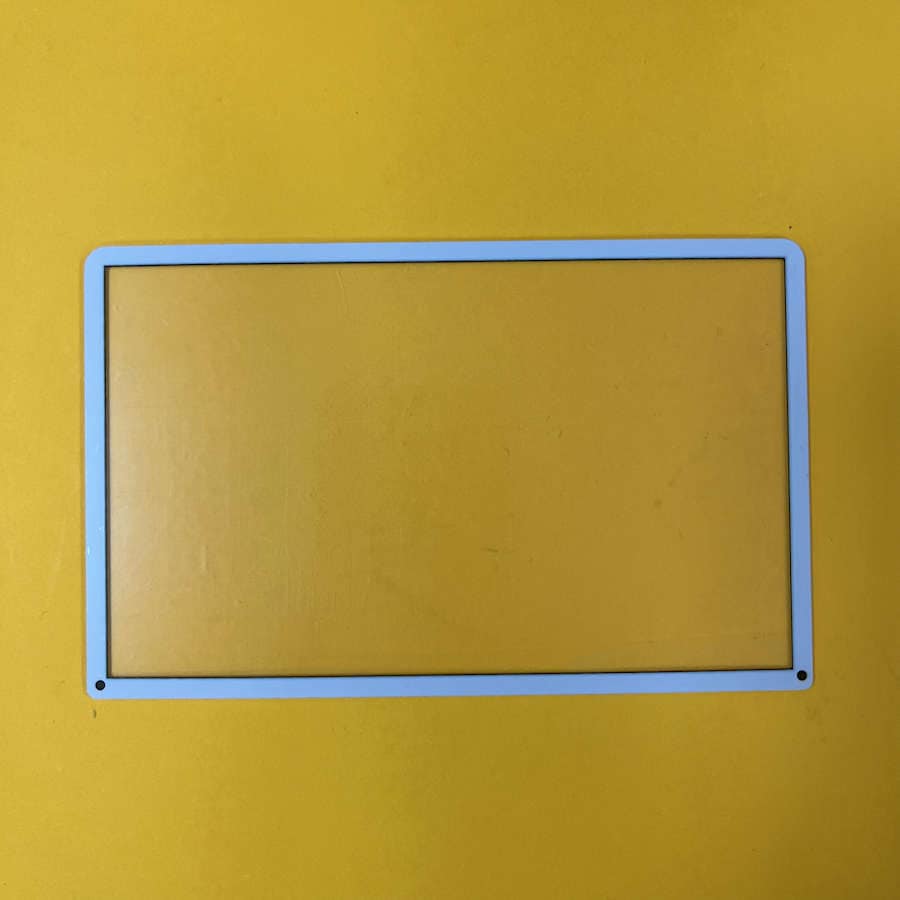 Black plastic top screen protector frame for Nintendo 3DS XL device.