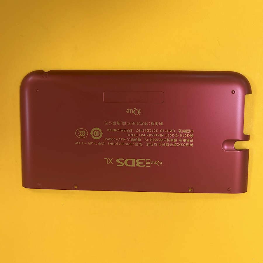 Red Nintendo 3DS XL shell with Charizard design on yellow background.