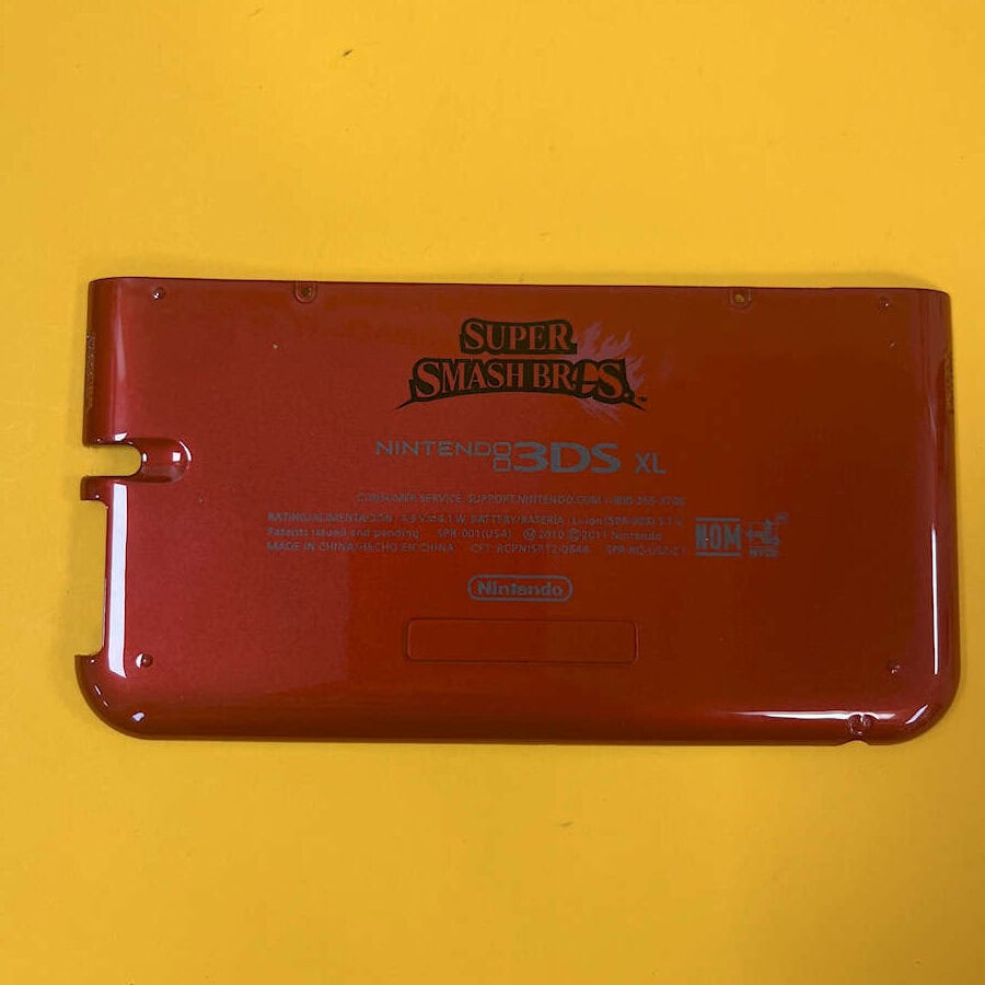 Red Nintendo 3DS XL shell with Super Smash Bros logo for sale.