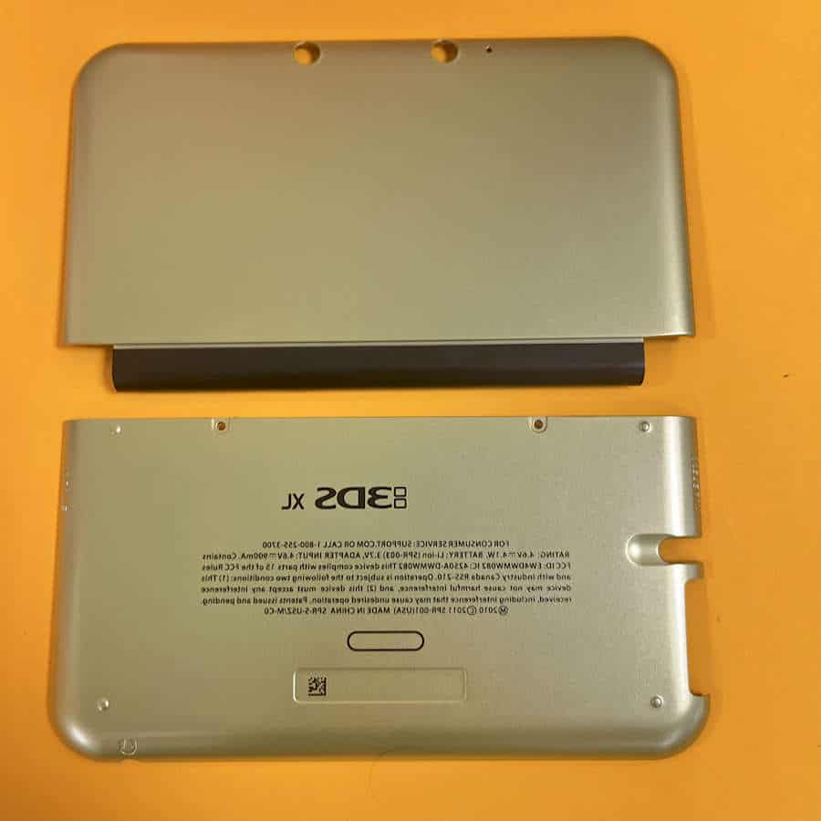 Gold Nintendo 3DS XL shell front and back covers for repair or customization.