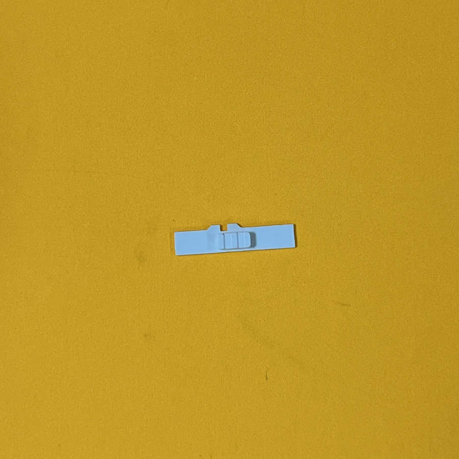 White volume slider replacement part for Nintendo 3DS XL console.