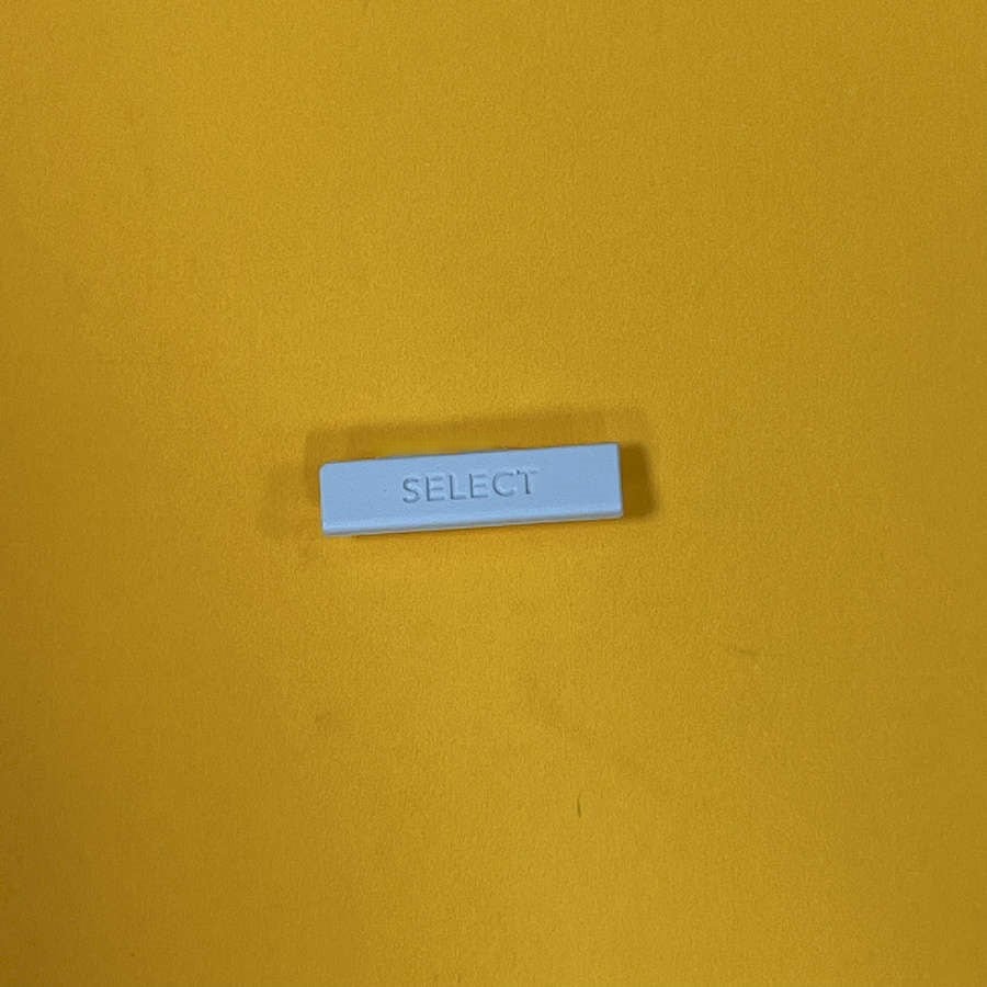 White Select button for Nintendo 3DS XL on yellow background.