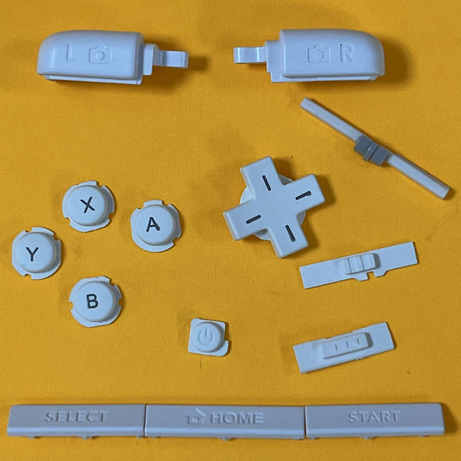 White replacement button set for Nintendo 3DS XL with directional pad and control buttons.