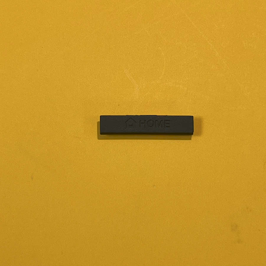 Black home button for Nintendo 3DS XL with 'HOME' label on yellow background.