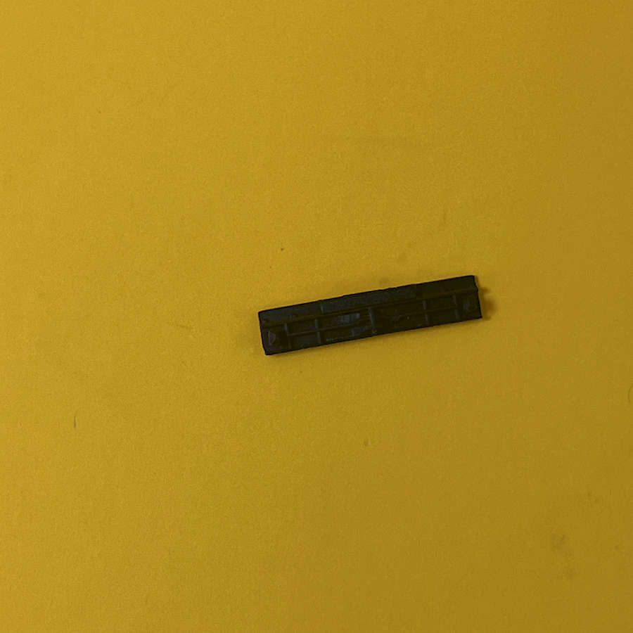 Black start button for Nintendo 3DS XL on yellow background.