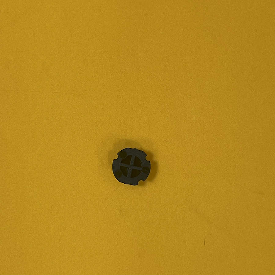 Black X button replacement part for Nintendo 3DS XL on yellow background.